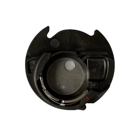 Black removable bobbin-area insert with a metal tension spring, shown from above.