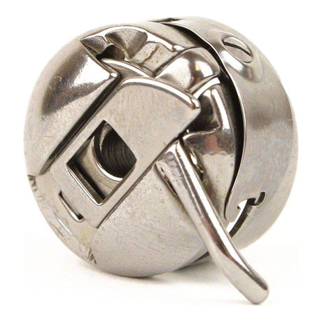 Removable metal bobbin case showing its latch and locating feature.